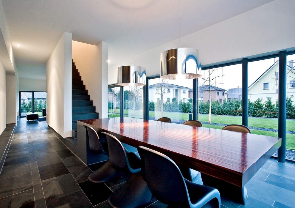 Great room - large modern great room idea in Dusseldorf with white walls