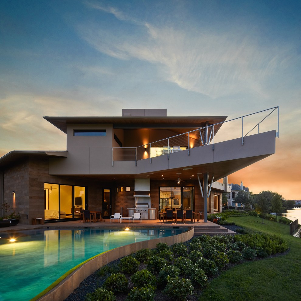 Inspiration pour une grande façade de maison beige minimaliste à un étage avec un revêtement mixte, un toit plat et un toit en métal.