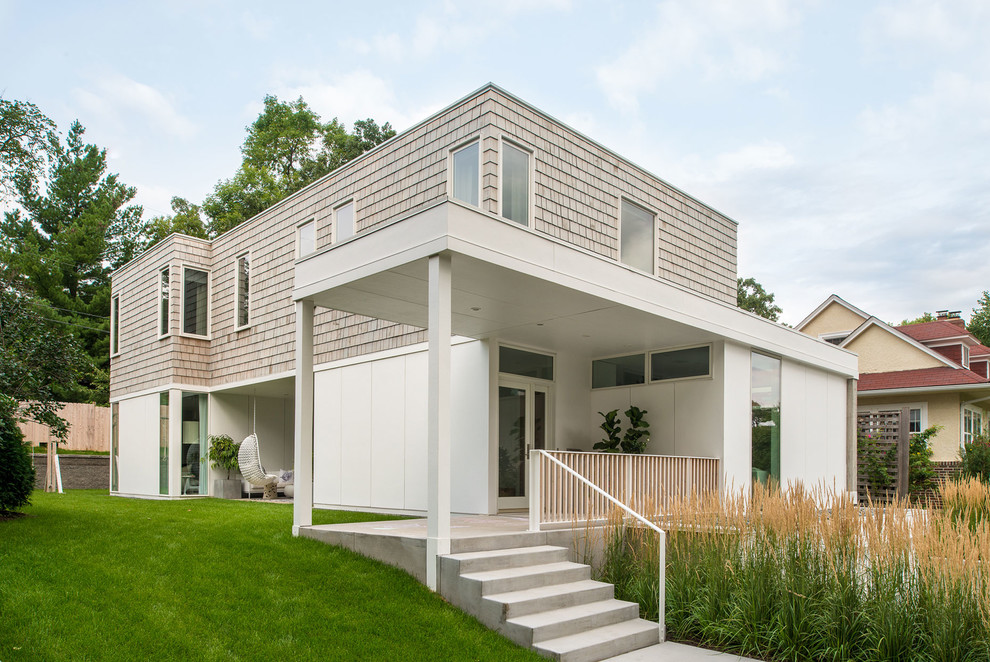 Design ideas for a white modern two floor house exterior in Minneapolis with wood cladding.