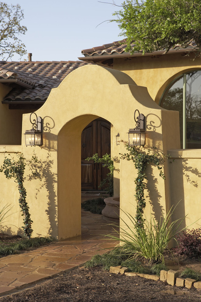 Example of a tuscan exterior home design in Austin