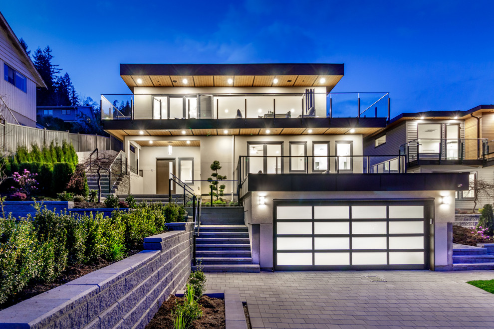 Modernes Einfamilienhaus mit Putzfassade und Flachdach in Vancouver