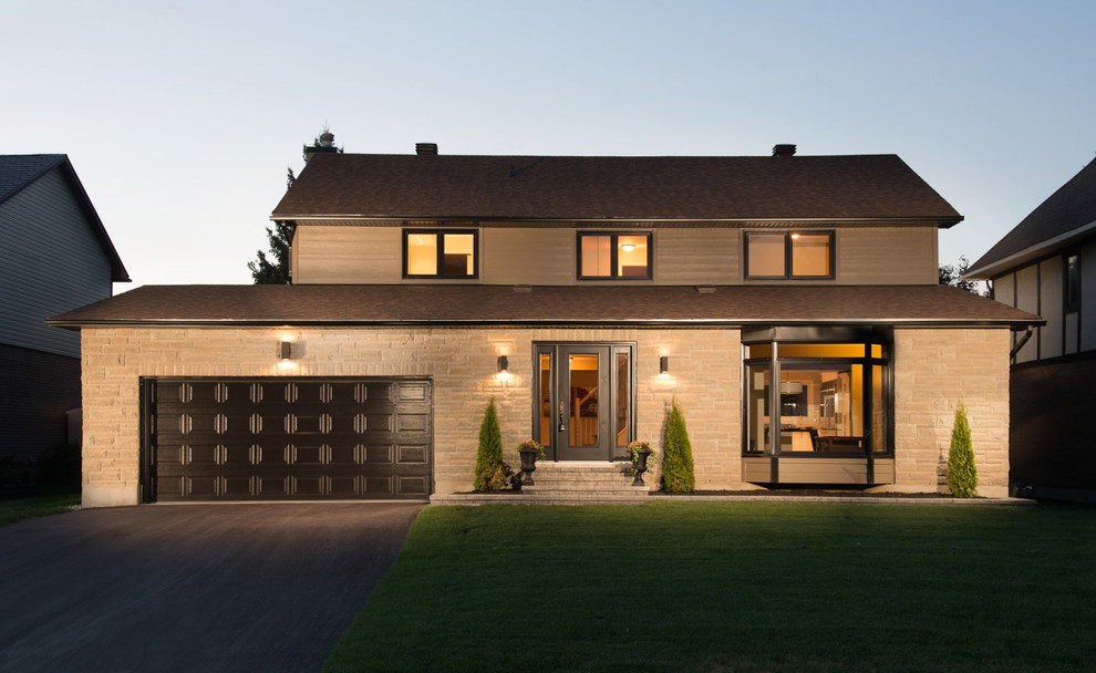 На фото: большой, двухэтажный, коричневый дом в классическом стиле с облицовкой из ЦСП и двускатной крышей