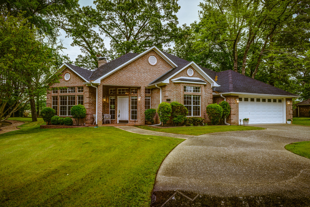 Large and red classic bungalow brick house exterior in Austin.