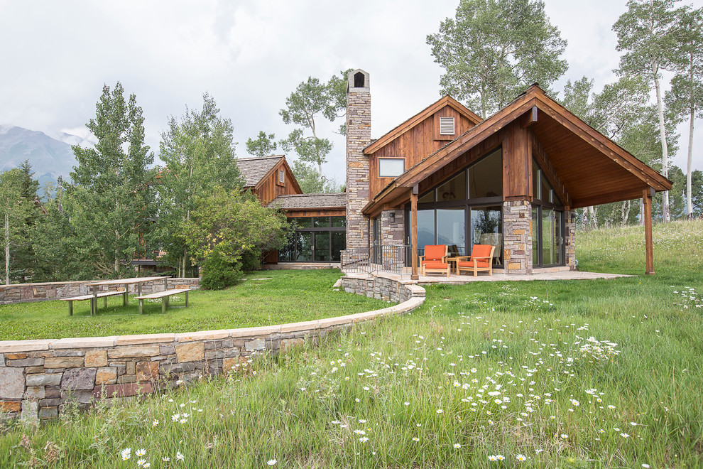 Inspiration for a rustic two-story exterior home remodel in Denver