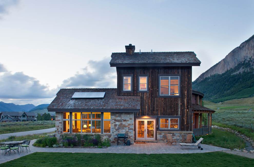 Inspiration for a rustic mixed siding exterior home remodel in Denver