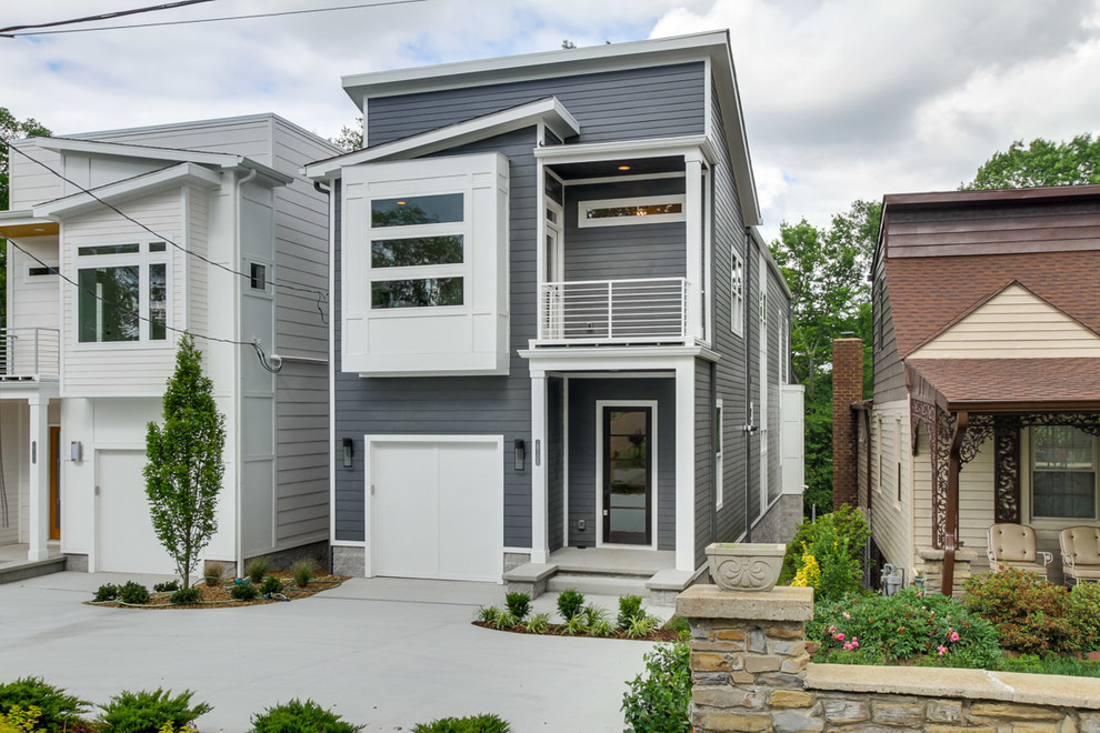 Mid-sized minimalist gray two-story mixed siding house exterior photo in Nashville with a shed roof and a shingle roof