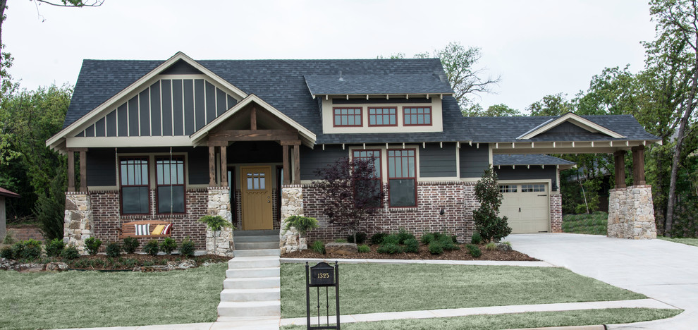 Large craftsman gray one-story mixed siding exterior home idea in Oklahoma City with a shingle roof