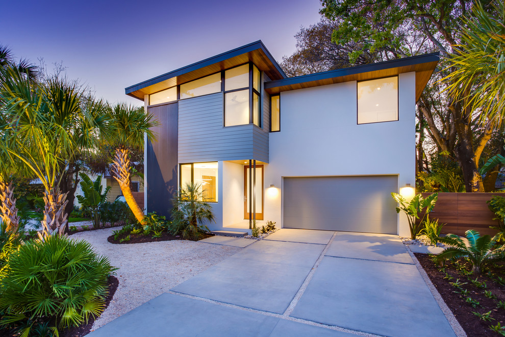 Small minimalist gray two-story mixed siding exterior home photo in Tampa with a shed roof