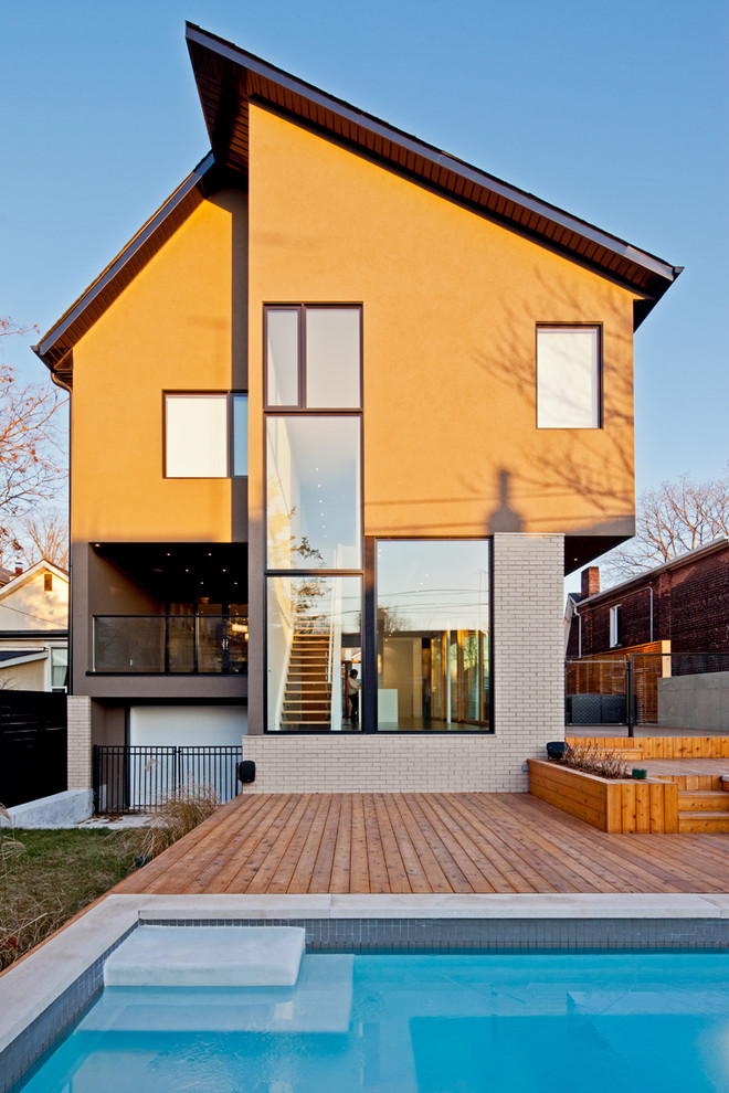 Design ideas for a contemporary brick house exterior in Toronto.