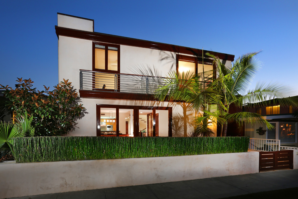 Photo of a beige contemporary two floor house exterior in Orange County.