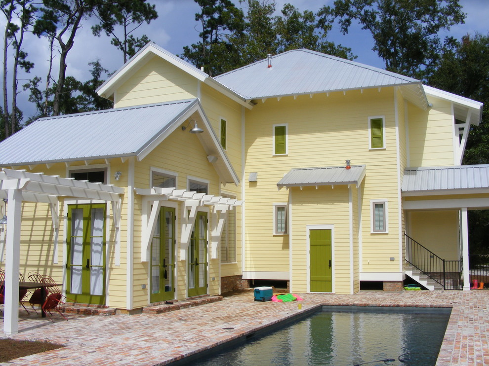 Photo of a yellow world-inspired house exterior in New Orleans.