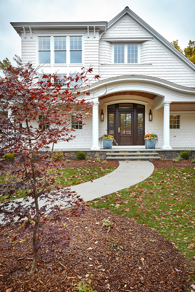 Elegant white exterior home photo in Grand Rapids