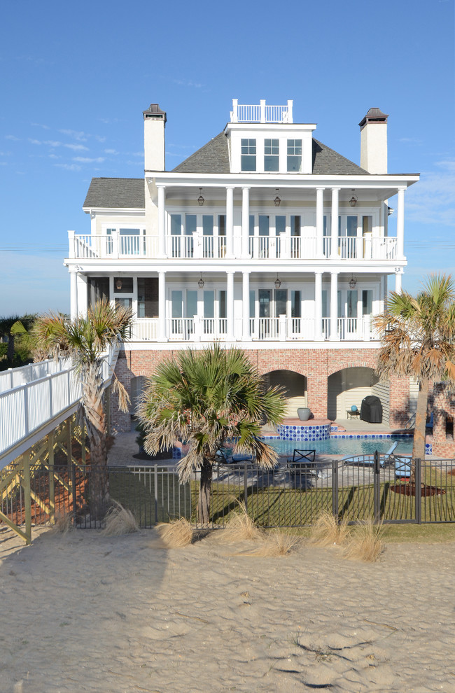 Huge beach style white three-story mixed siding house exterior photo in Other with a hip roof and a shingle roof