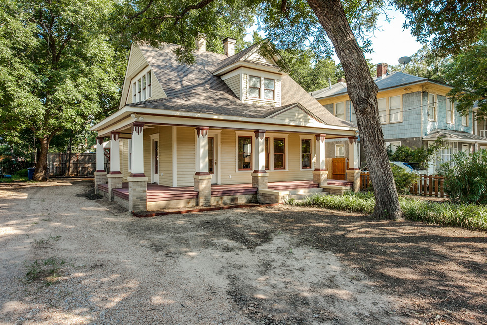 Inspiration for a mid-sized craftsman beige two-story wood exterior home remodel in Dallas with a shingle roof