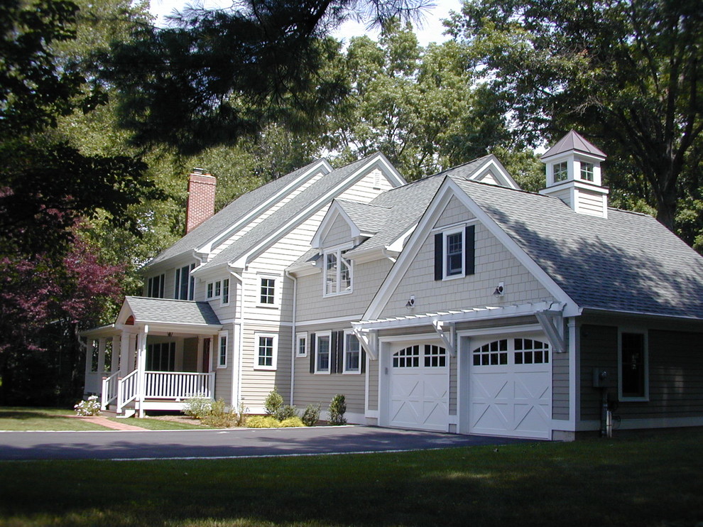 Inspiration for a large timeless gray two-story wood gable roof remodel in New York