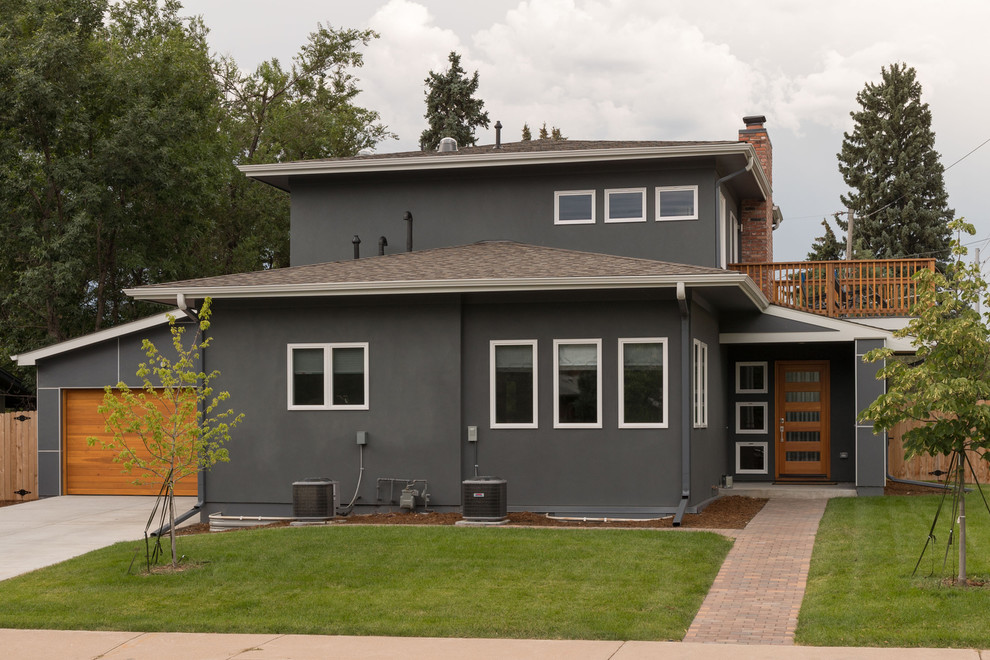 Mid-sized mid-century modern gray two-story concrete fiberboard gable roof photo in Denver