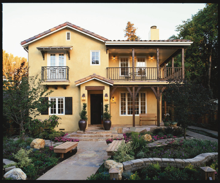 Inspiration for a mid-sized mediterranean two-story stucco exterior home remodel in San Francisco