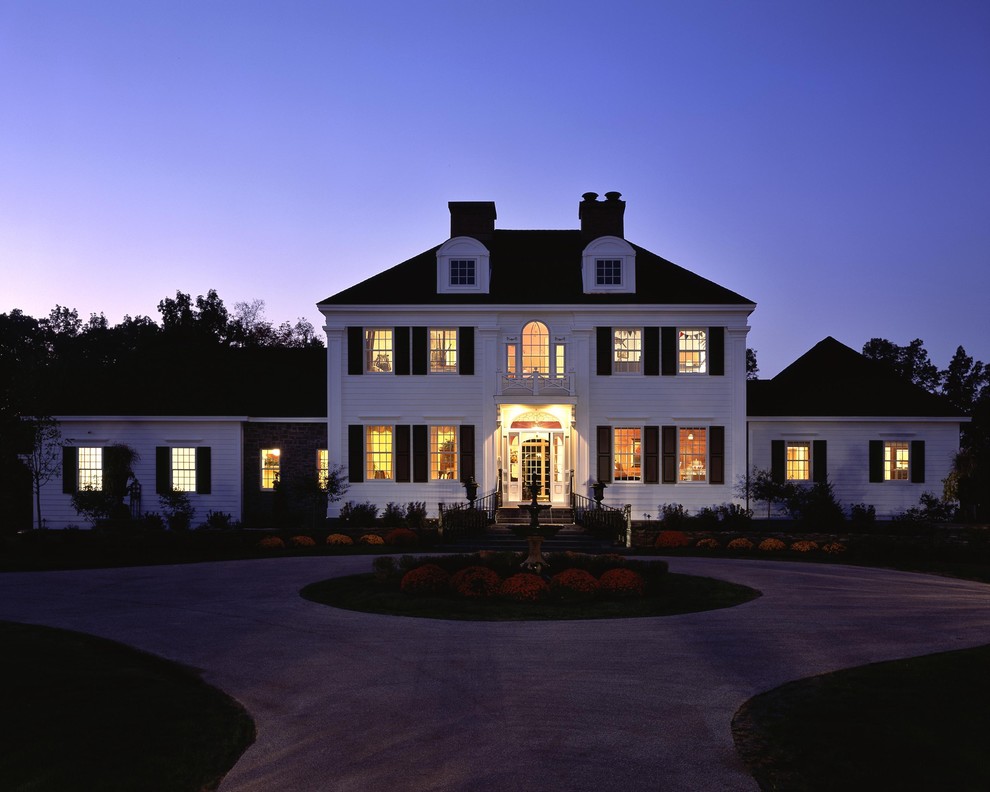 Inspiration for a timeless wood exterior home remodel in New York with a hip roof