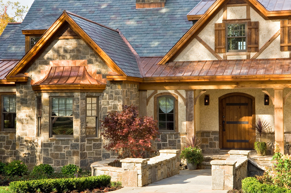 Mountain style stone exterior home photo in New York