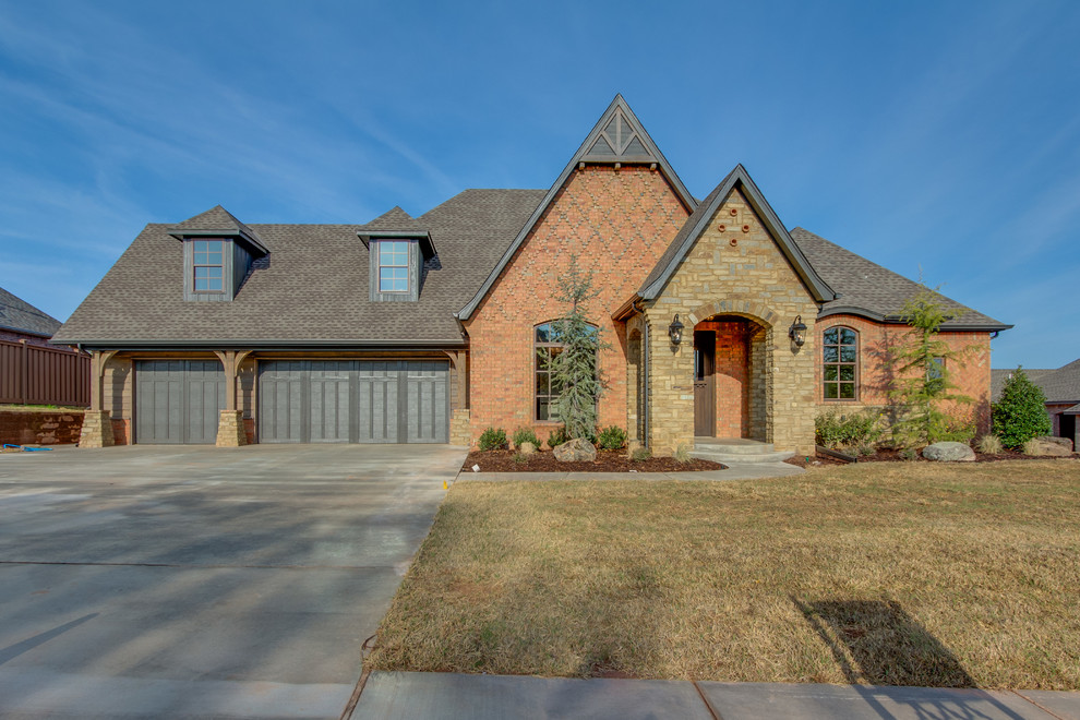 Mid-sized traditional brown two-story brick gable roof idea in Oklahoma City