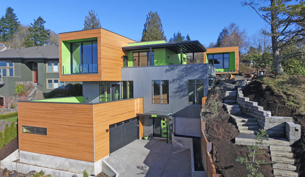 Idées déco pour une façade de maison métallique et multicolore contemporaine à deux étages et plus.
