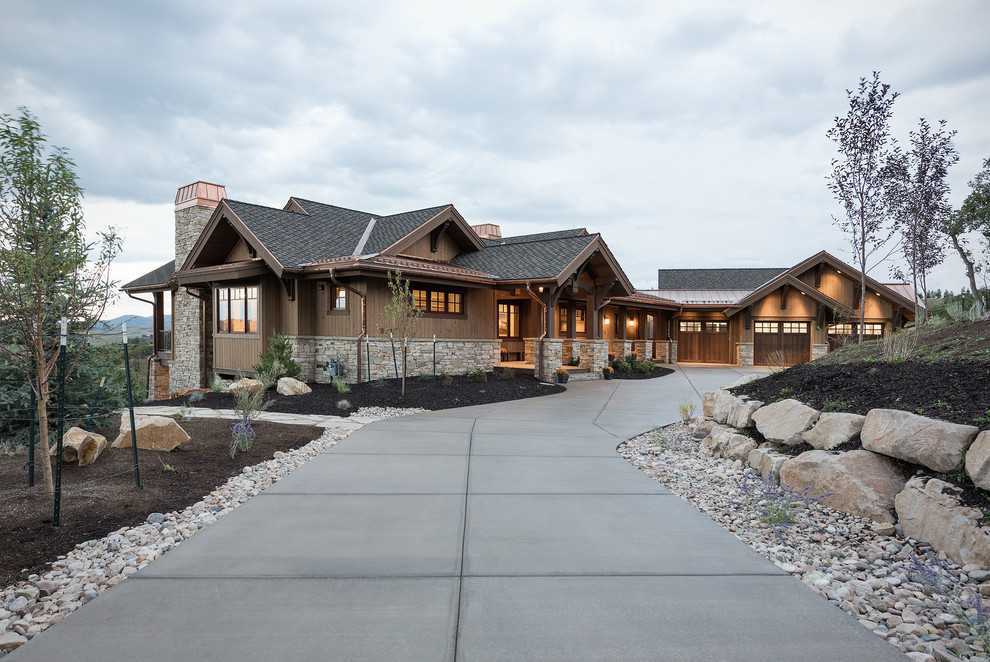 Design ideas for an expansive and brown rustic two floor house exterior in Salt Lake City with mixed cladding and a half-hip roof.