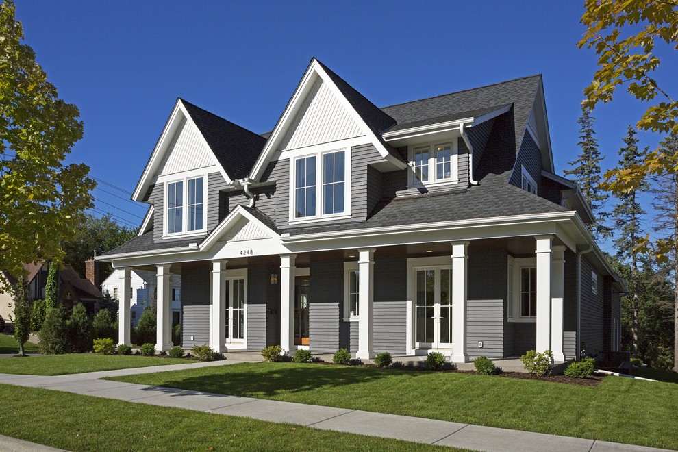 Large transitional gray two-story vinyl exterior home photo in Minneapolis with a shingle roof