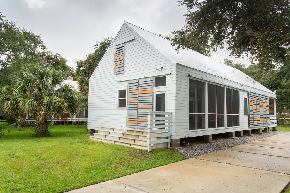 Modelo de fachada de casa gris minimalista de dos plantas con tejado de metal