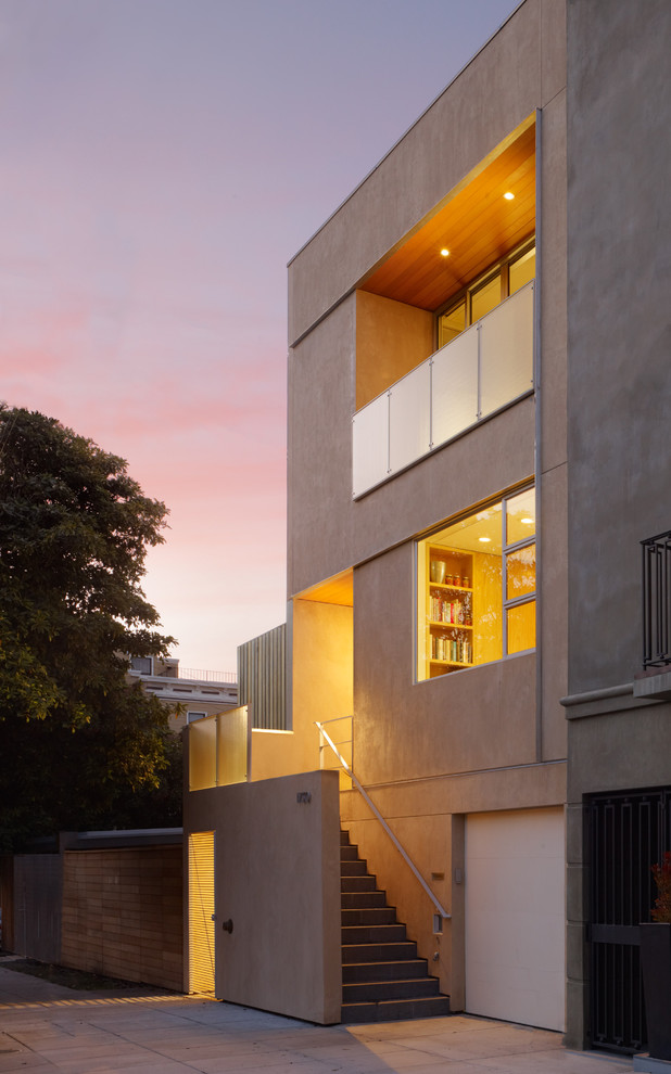Idee per la facciata di una casa contemporanea con rivestimento in stucco