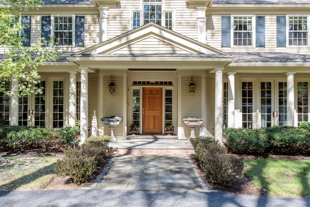 Inspiration for a huge timeless beige three-story wood house exterior remodel in Boston