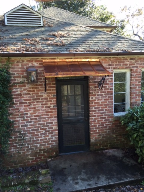 Example of a mid-sized classic brown one-story brick gable roof design in Atlanta