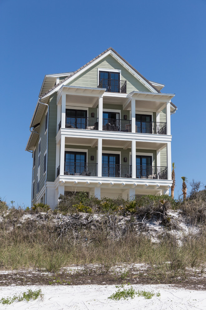 Coastal three-story exterior home idea in Miami