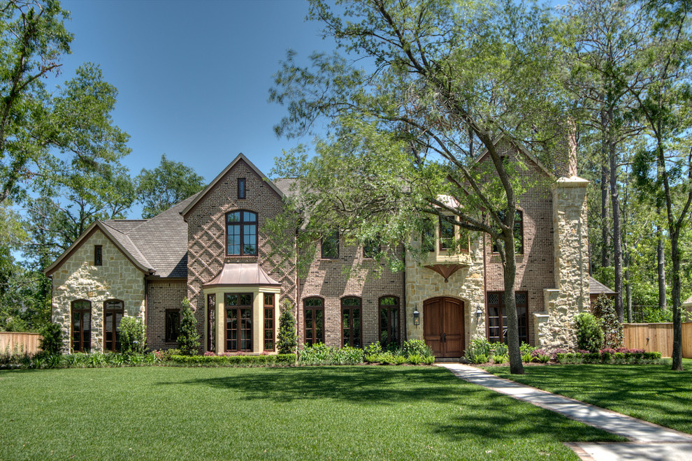 Inspiration for a classic house exterior in Houston with mixed cladding.