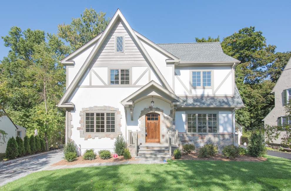 Traditional white two-story exterior home idea in New York with a shingle roof
