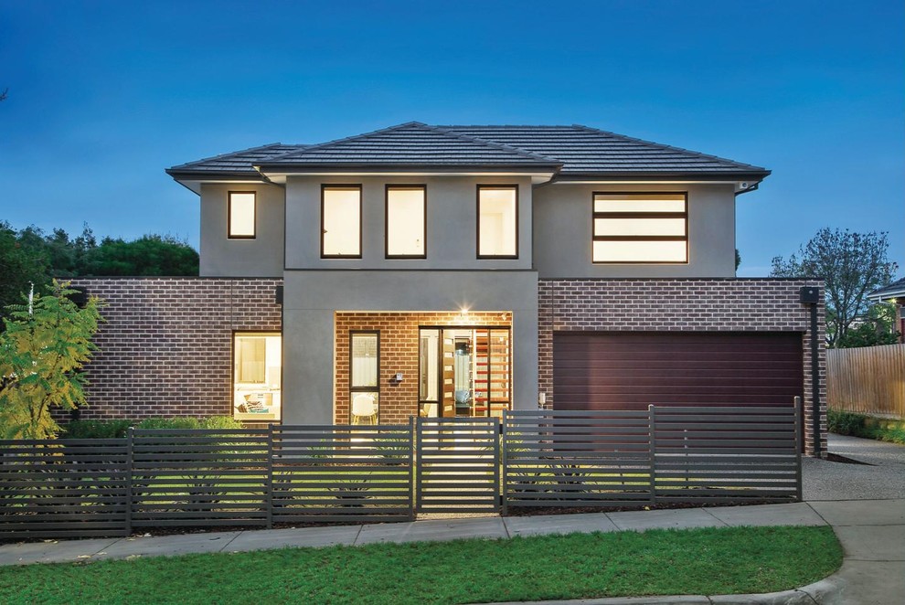 Design ideas for a large and brown modern two floor brick terraced house in Melbourne with a hip roof and a tiled roof.