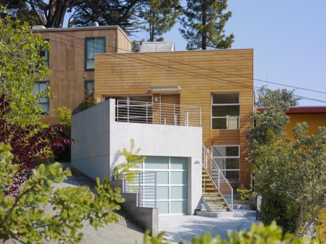 Large modern brown two-story wood flat roof idea in San Francisco