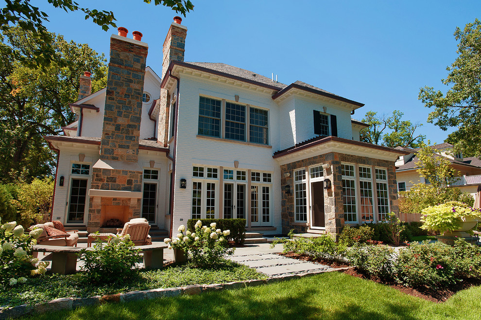 This is an example of a contemporary house exterior in Chicago with stone cladding.