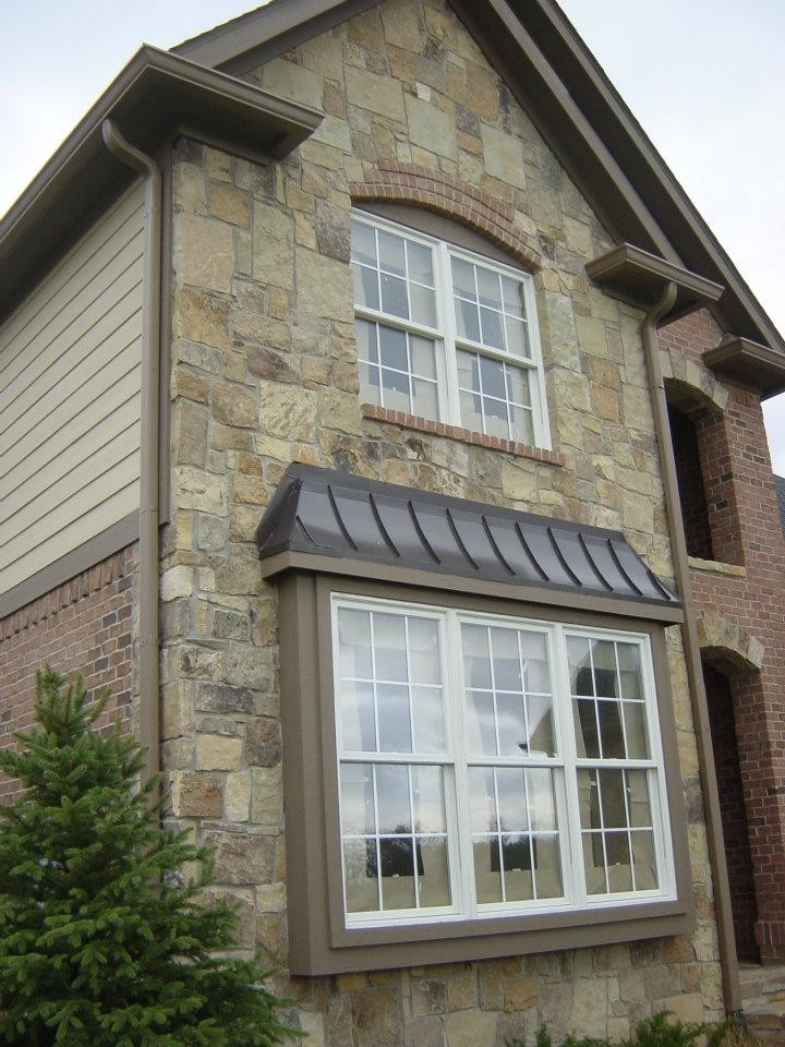 Inspiration for a rustic two-story mixed siding exterior home remodel in Indianapolis