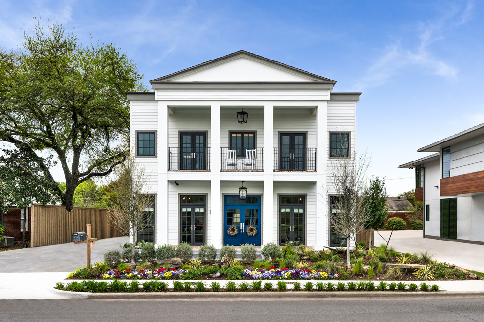 Example of a classic white two-story exterior home design in Dallas