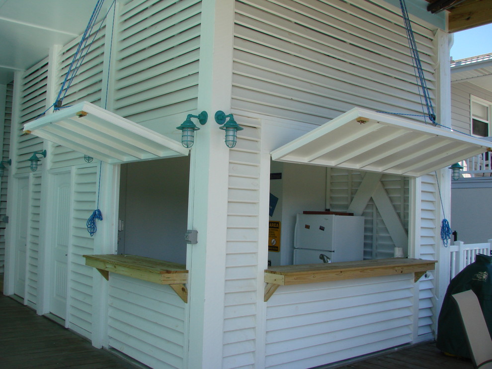 This is an example of a beach style house exterior in Other.