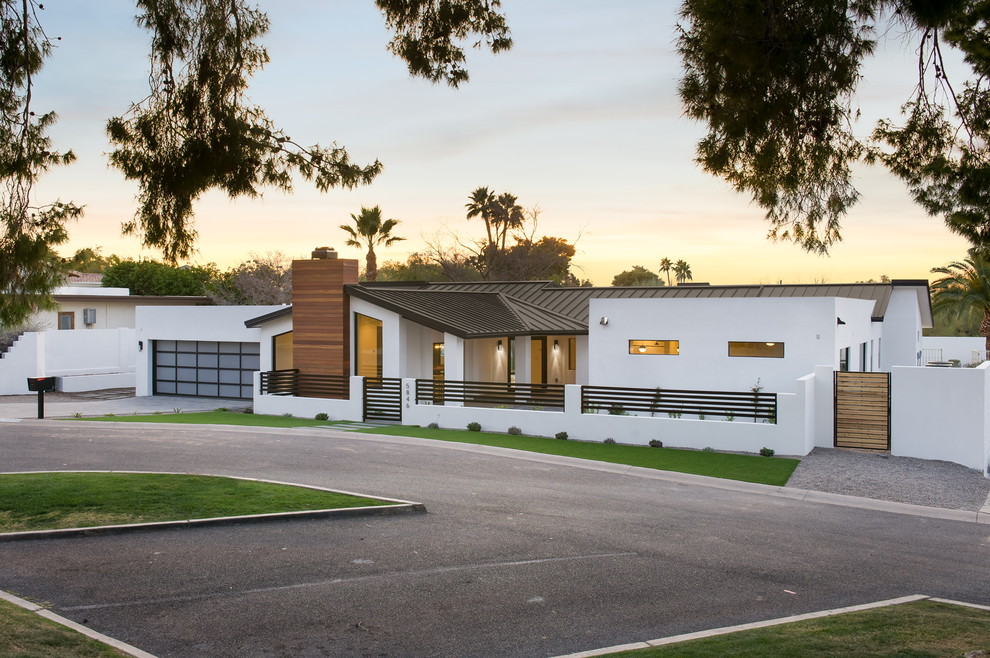 Design ideas for a white contemporary bungalow render house exterior in Phoenix.