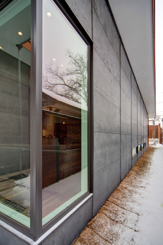 Idee per la facciata di una casa contemporanea a un piano con rivestimento in metallo