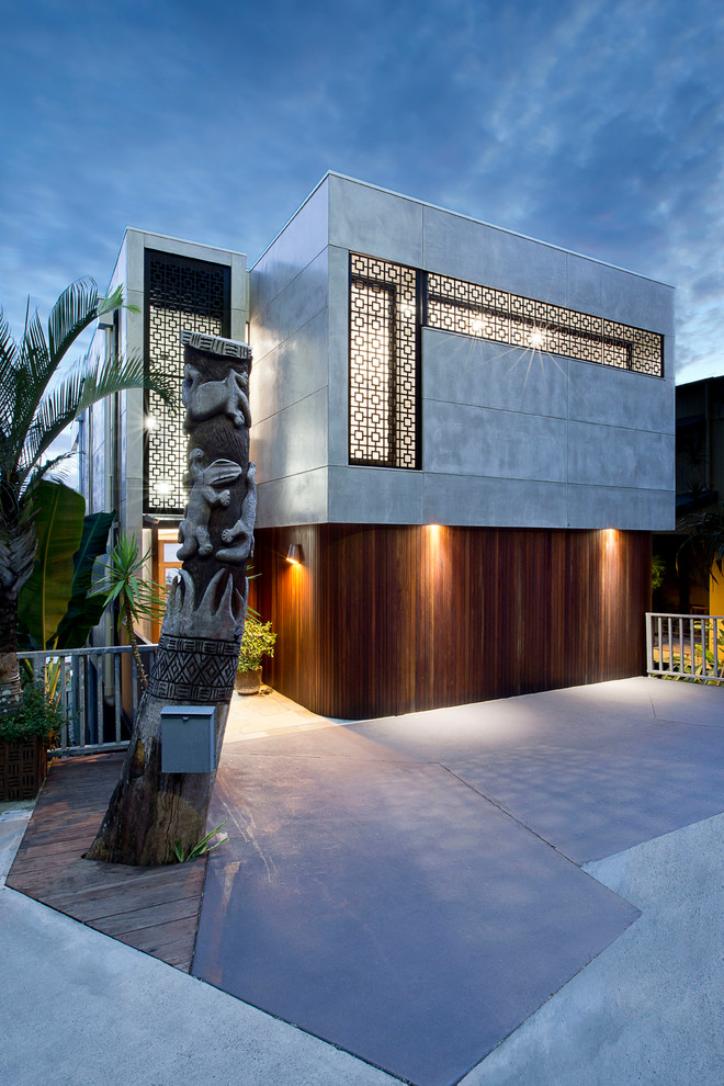 Inspiration for a modern house exterior in Gold Coast - Tweed with three floors and concrete fibreboard cladding.