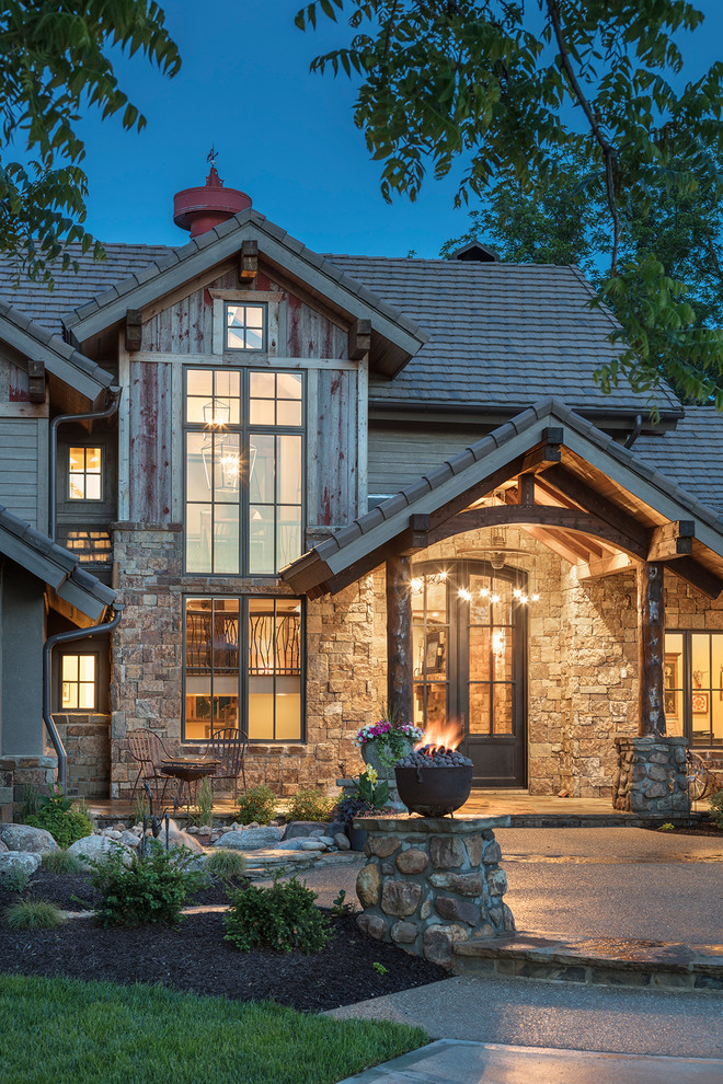 Design ideas for a rustic house exterior in Kansas City.