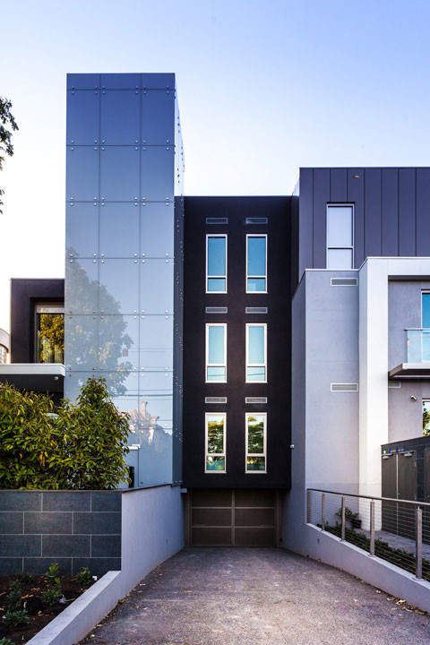 This is an example of a contemporary house exterior in Melbourne with three floors.