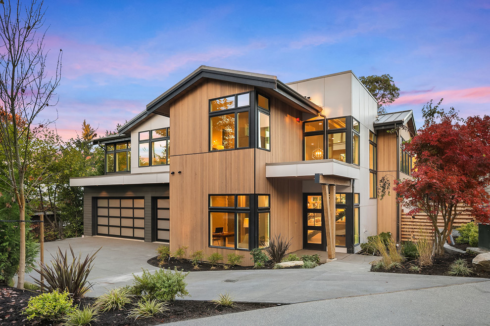 Brown contemporary two floor detached house in Seattle with mixed cladding, a pitched roof and a metal roof.