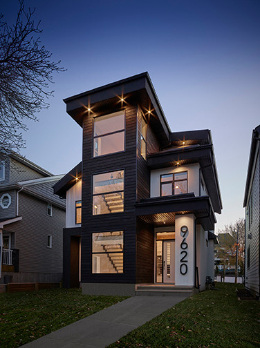 Mid-sized contemporary three-story mixed siding house exterior idea in Edmonton