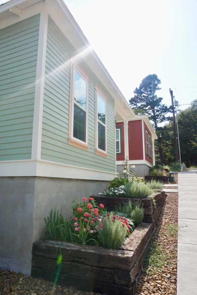 This is an example of a small traditional bungalow detached house in Other with a shingle roof.