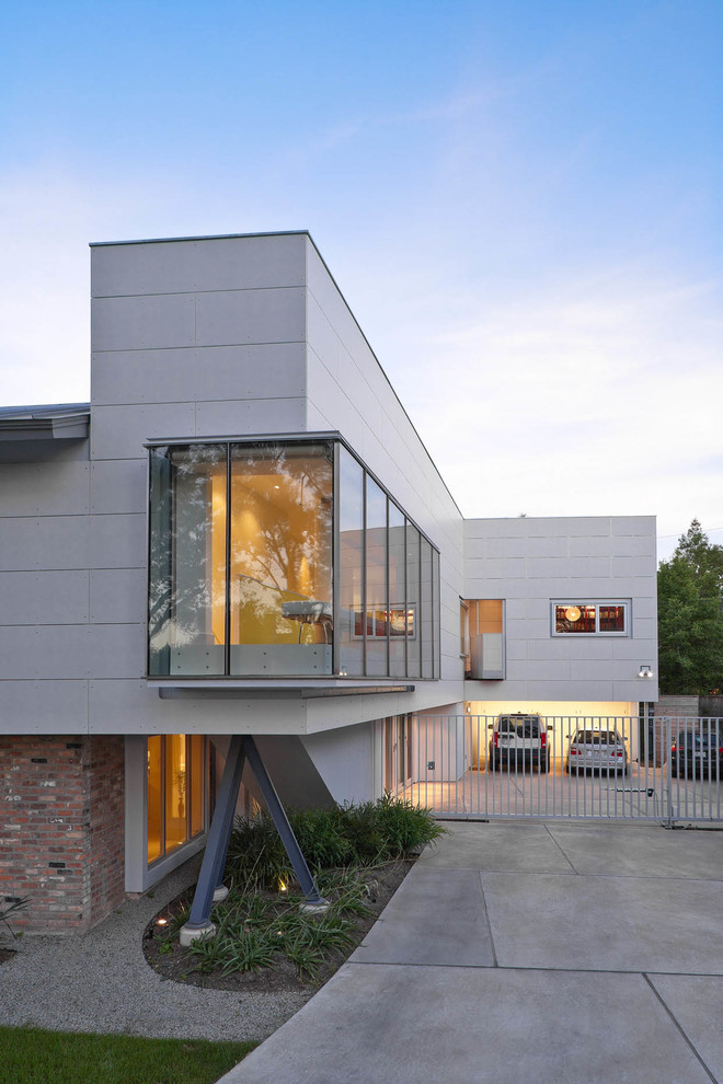 Cette photo montre une façade de maison tendance à un étage avec un revêtement mixte.