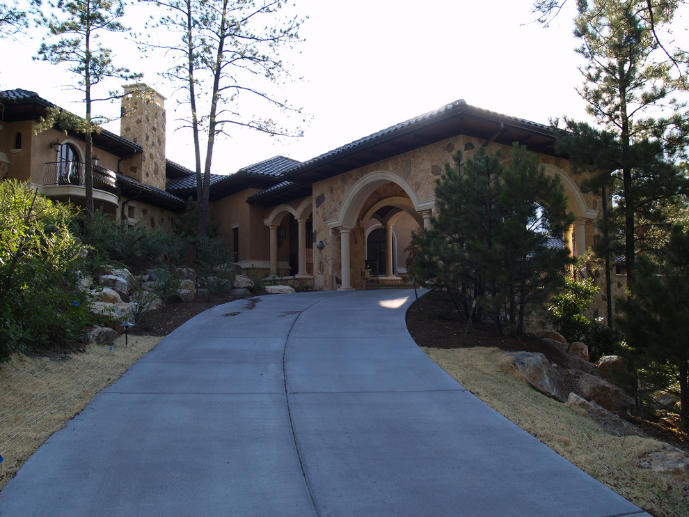 Example of a tuscan exterior home design in Denver